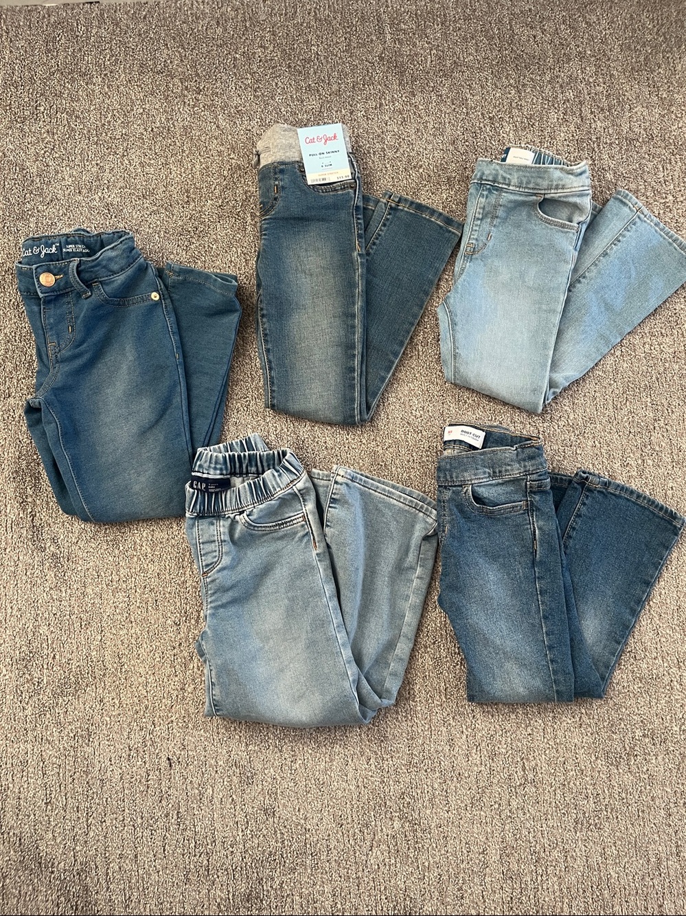 Five pairs of girls jeans